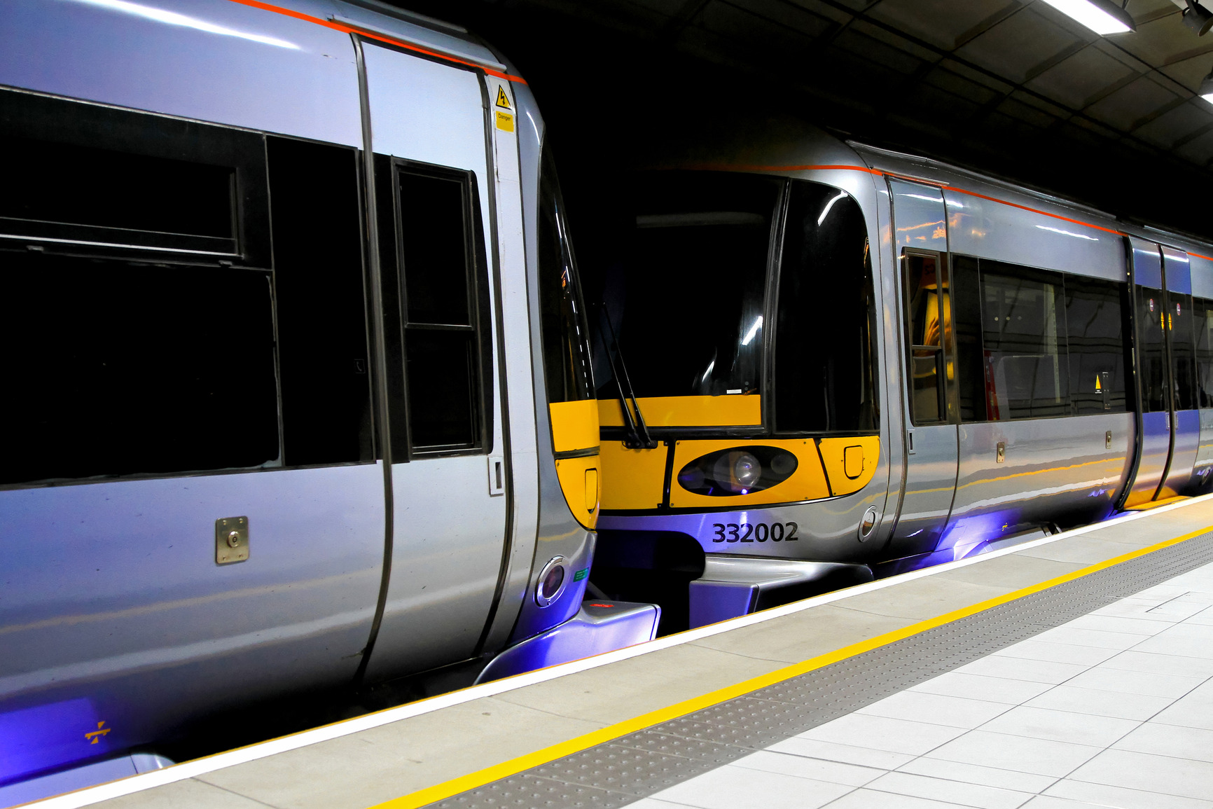 Modern speed train standing at underground platform